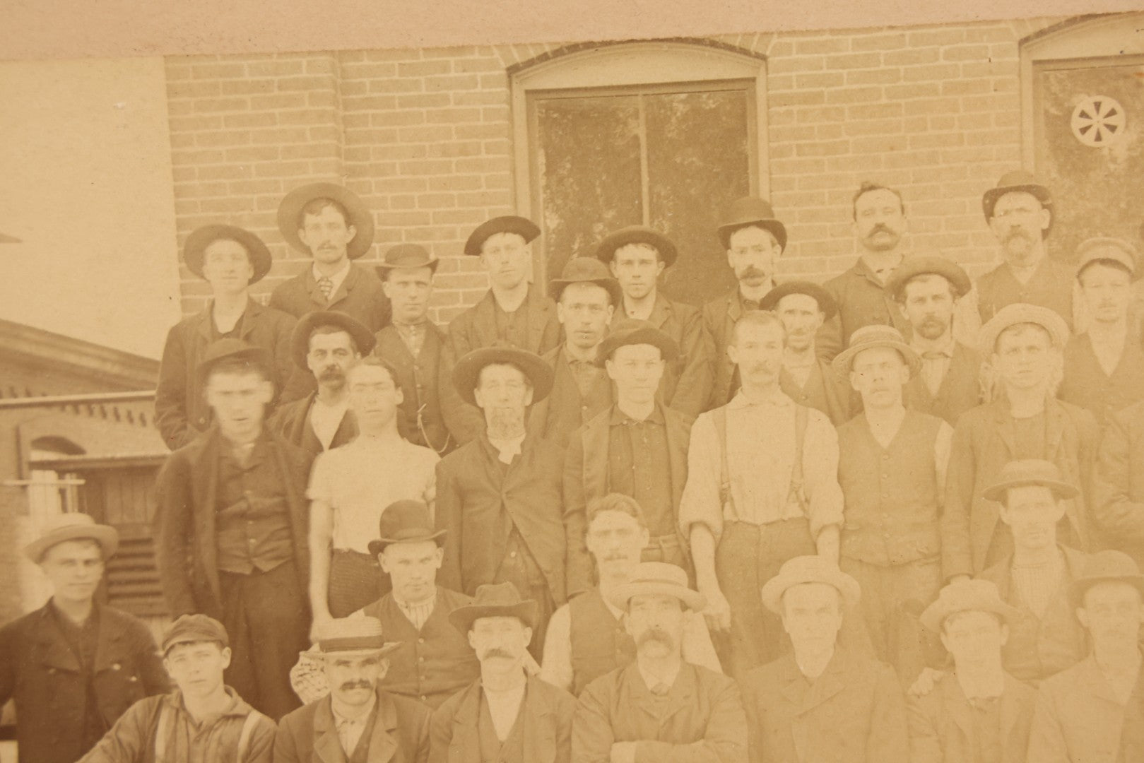 Lot 137 - Antique Occupational Boarded Photograph Of Factory Workers With Dog In Deep Walnut Frame, Circa 1880–1890, 13-1/2" x 11-1/2"