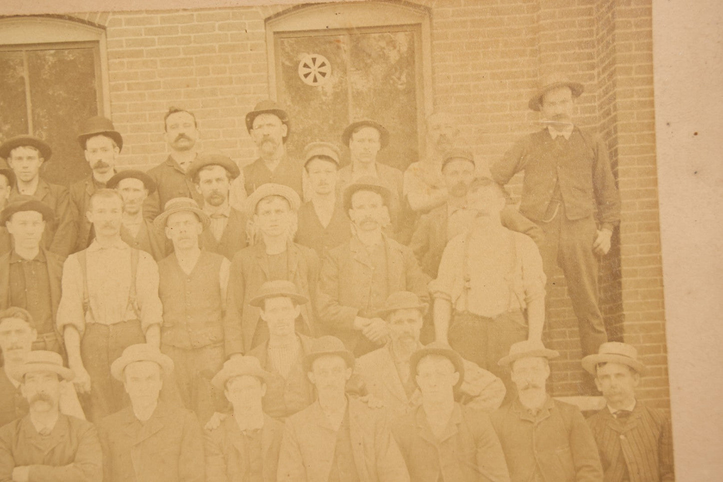 Lot 137 - Antique Occupational Boarded Photograph Of Factory Workers With Dog In Deep Walnut Frame, Circa 1880–1890, 13-1/2" x 11-1/2"