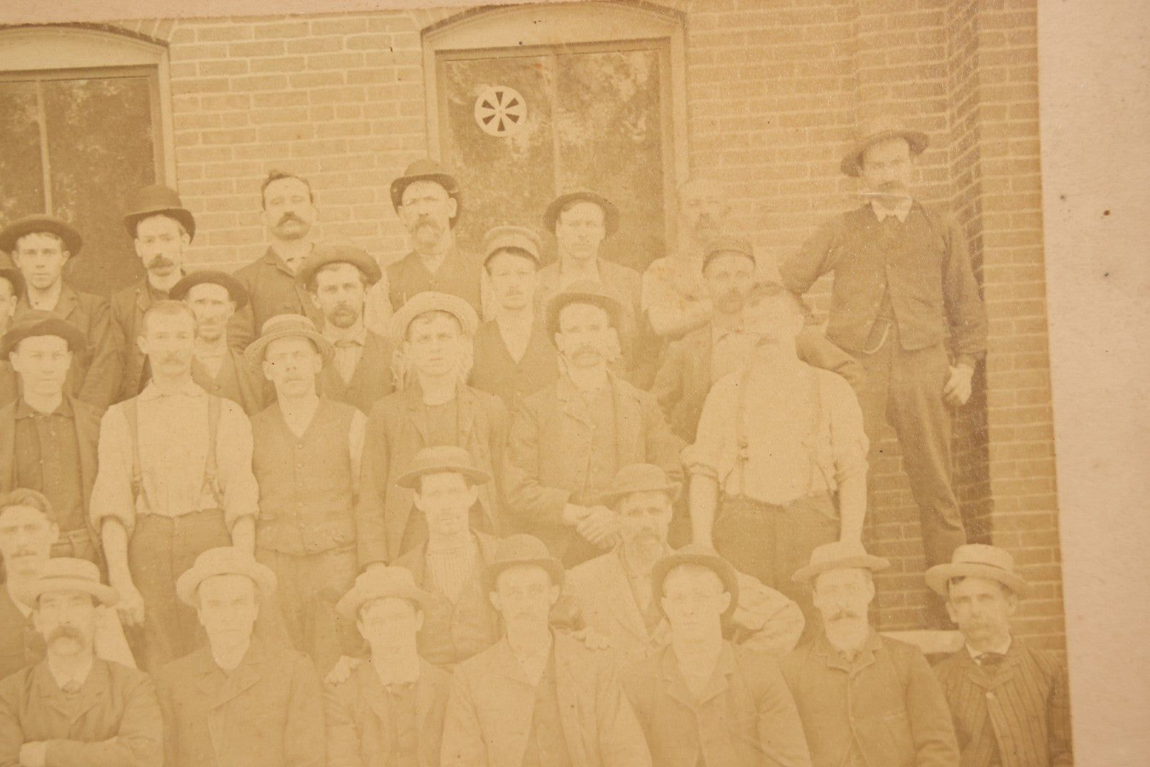Lot 137 - Antique Occupational Boarded Photograph Of Factory Workers With Dog In Deep Walnut Frame, Circa 1880–1890, 13-1/2" x 11-1/2"