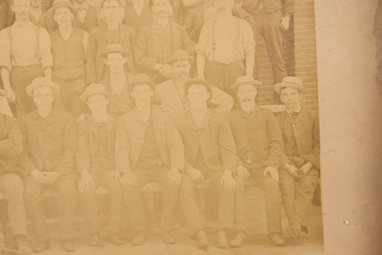 Lot 137 - Antique Occupational Boarded Photograph Of Factory Workers With Dog In Deep Walnut Frame, Circa 1880–1890, 13-1/2" x 11-1/2"