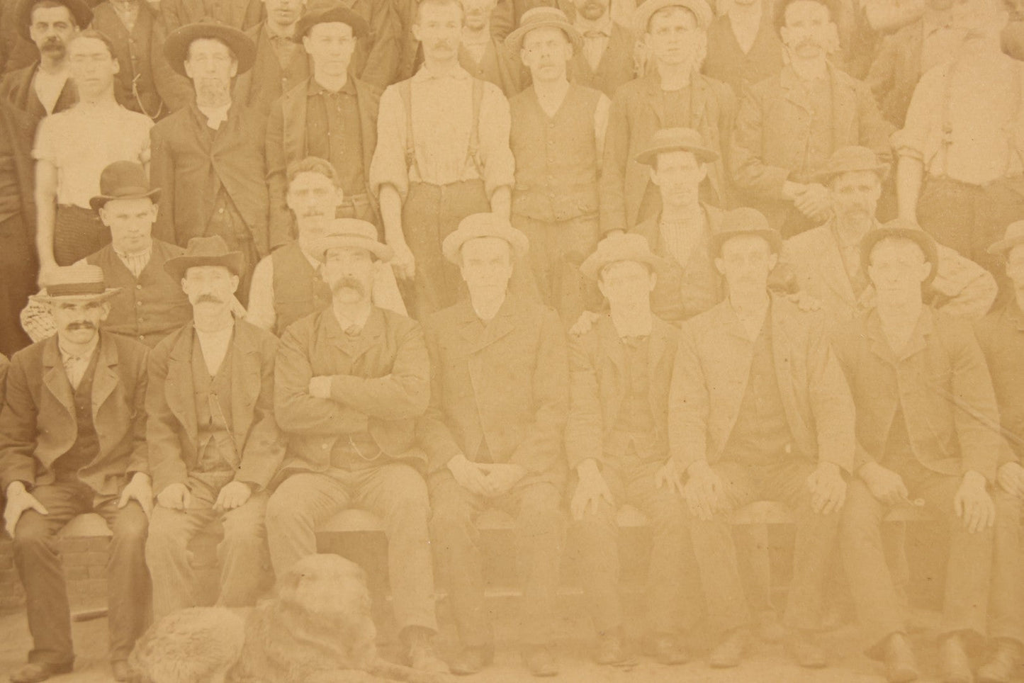 Lot 137 - Antique Occupational Boarded Photograph Of Factory Workers With Dog In Deep Walnut Frame, Circa 1880–1890, 13-1/2" x 11-1/2"