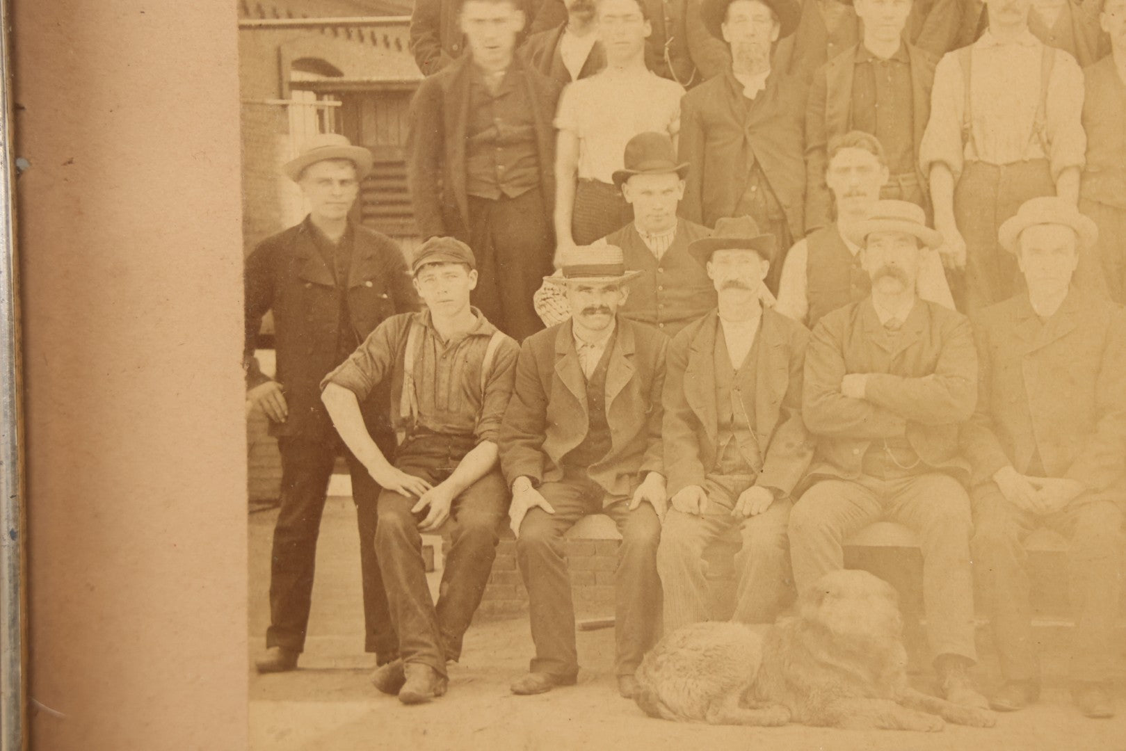 Lot 137 - Antique Occupational Boarded Photograph Of Factory Workers With Dog In Deep Walnut Frame, Circa 1880–1890, 13-1/2" x 11-1/2"