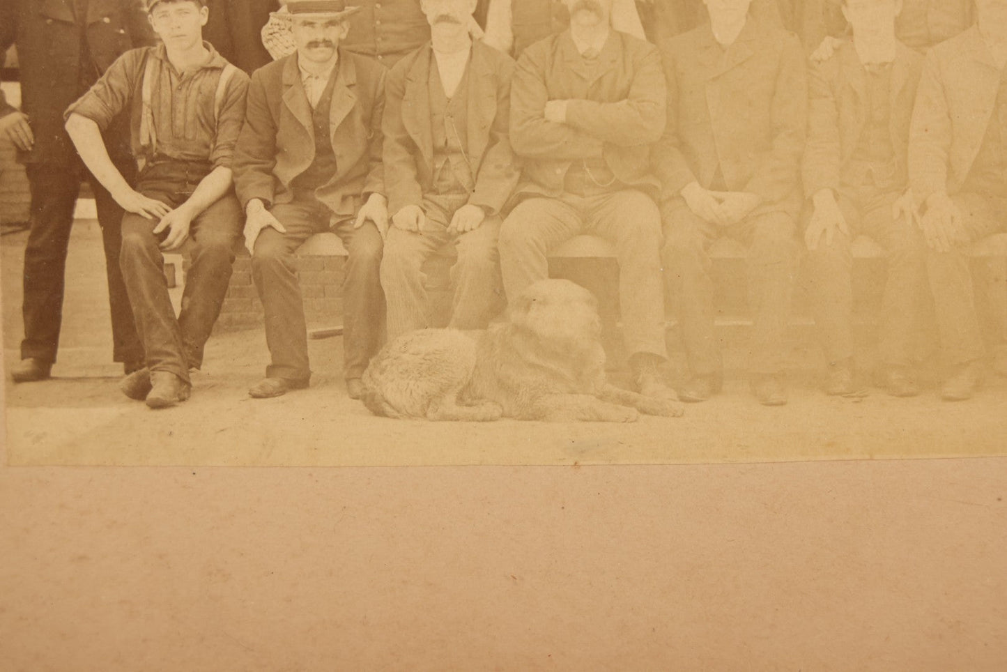 Lot 137 - Antique Occupational Boarded Photograph Of Factory Workers With Dog In Deep Walnut Frame, Circa 1880–1890, 13-1/2" x 11-1/2"