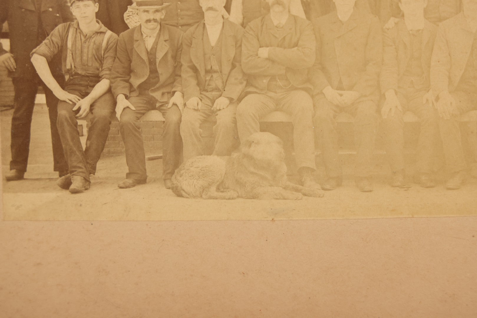Lot 137 - Antique Occupational Boarded Photograph Of Factory Workers With Dog In Deep Walnut Frame, Circa 1880–1890, 13-1/2" x 11-1/2"