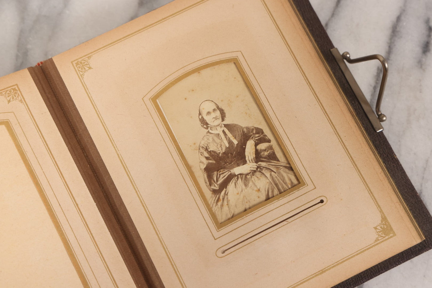 Lot 140 - Antique Portrait Photograph Album With 15 Carte De Visite C.D.V.., 2 Cabinet Card, And 3 Tintype Photographs Of Men, Women, And Children