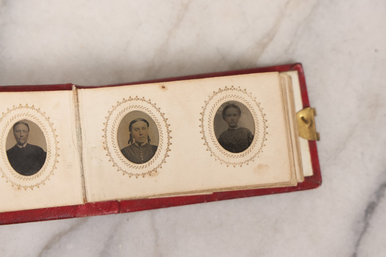 Lot 141 - Antique Gem Tintype Album With 26 Gem Tintype Photographs Including Man In Uniform, Note Binding In Poor Condition