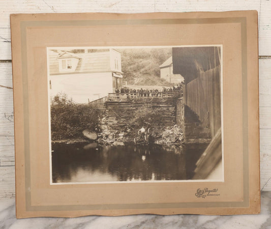 Lot 143 - Antique Boarded Photograph Of Crowd Overlooking Car Accident Scene Above River, Recovery In Progress, Photographed By Paquette, Beecher Falls, Vermont, Circa 1920