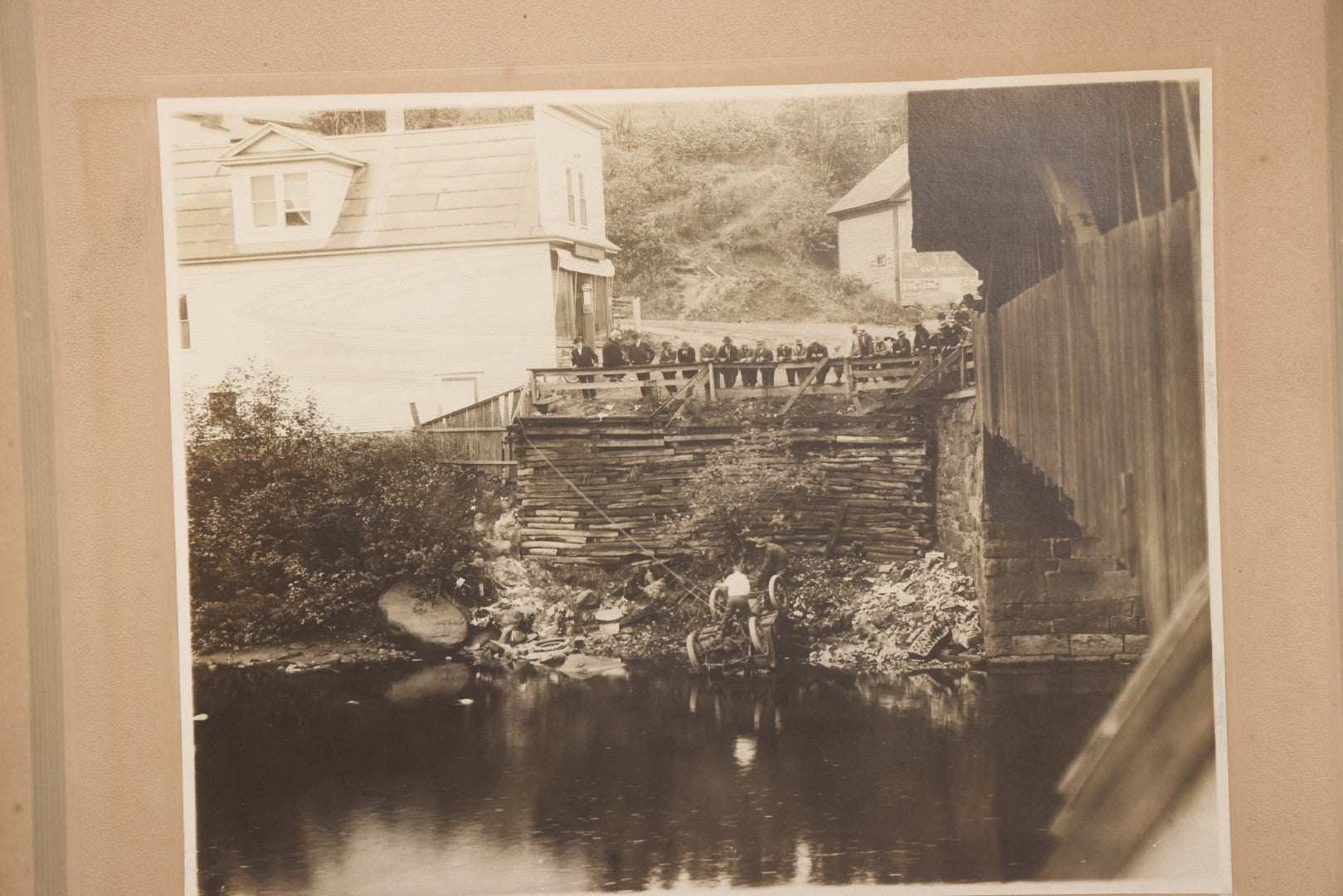 Lot 143 - Antique Boarded Photograph Of Crowd Overlooking Car Accident Scene Above River, Recovery In Progress, Photographed By Paquette, Beecher Falls, Vermont, Circa 1920
