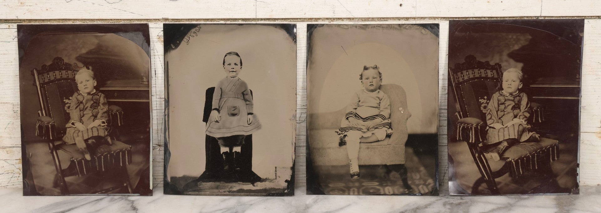Lot 148 - Grouping Of Four Antique Full Plate Tintype Photographs Of Children In Studio Settings