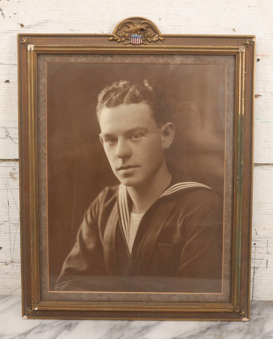 Lot 150 - Vintage Portrait Photograph Of World War Two Era Navy Sailor In Patriotic Frame With Eagle And Shield Crest, Photographed By Oliver