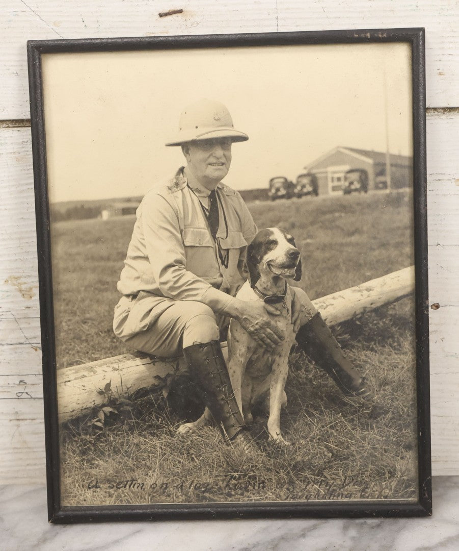 Lot 151 - Pair Of Vintage Military Portrait Photographs In Matching Black Wood Frames, Including Officer With Dog On Log Captioned "A Settin On A Log, Lovin On My Dog" And Portrait Inscribed To Captain James P. Baruly Jr.