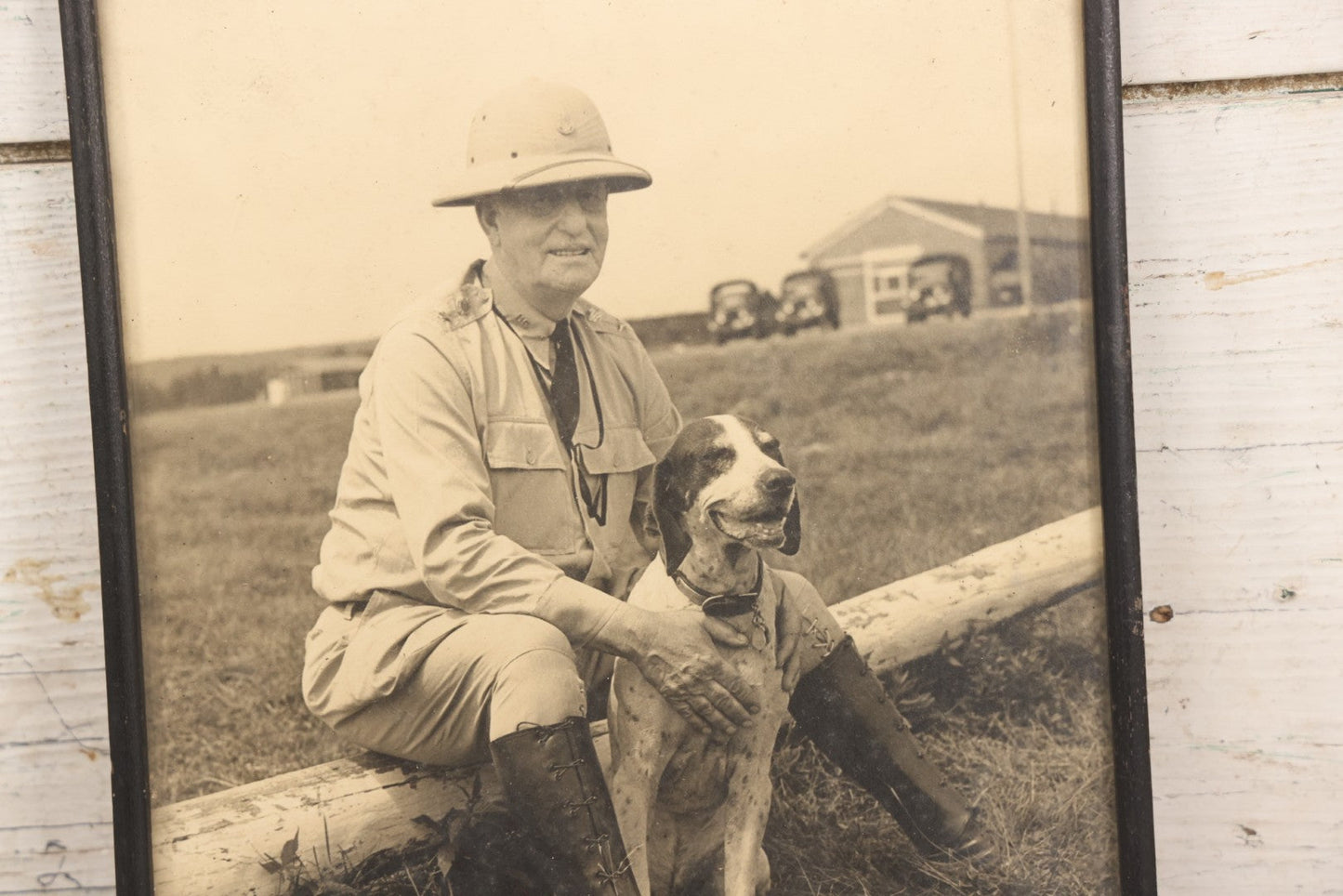 Lot 151 - Pair Of Vintage Military Portrait Photographs In Matching Black Wood Frames, Including Officer With Dog On Log Captioned "A Settin On A Log, Lovin On My Dog" And Portrait Inscribed To Captain James P. Baruly Jr.