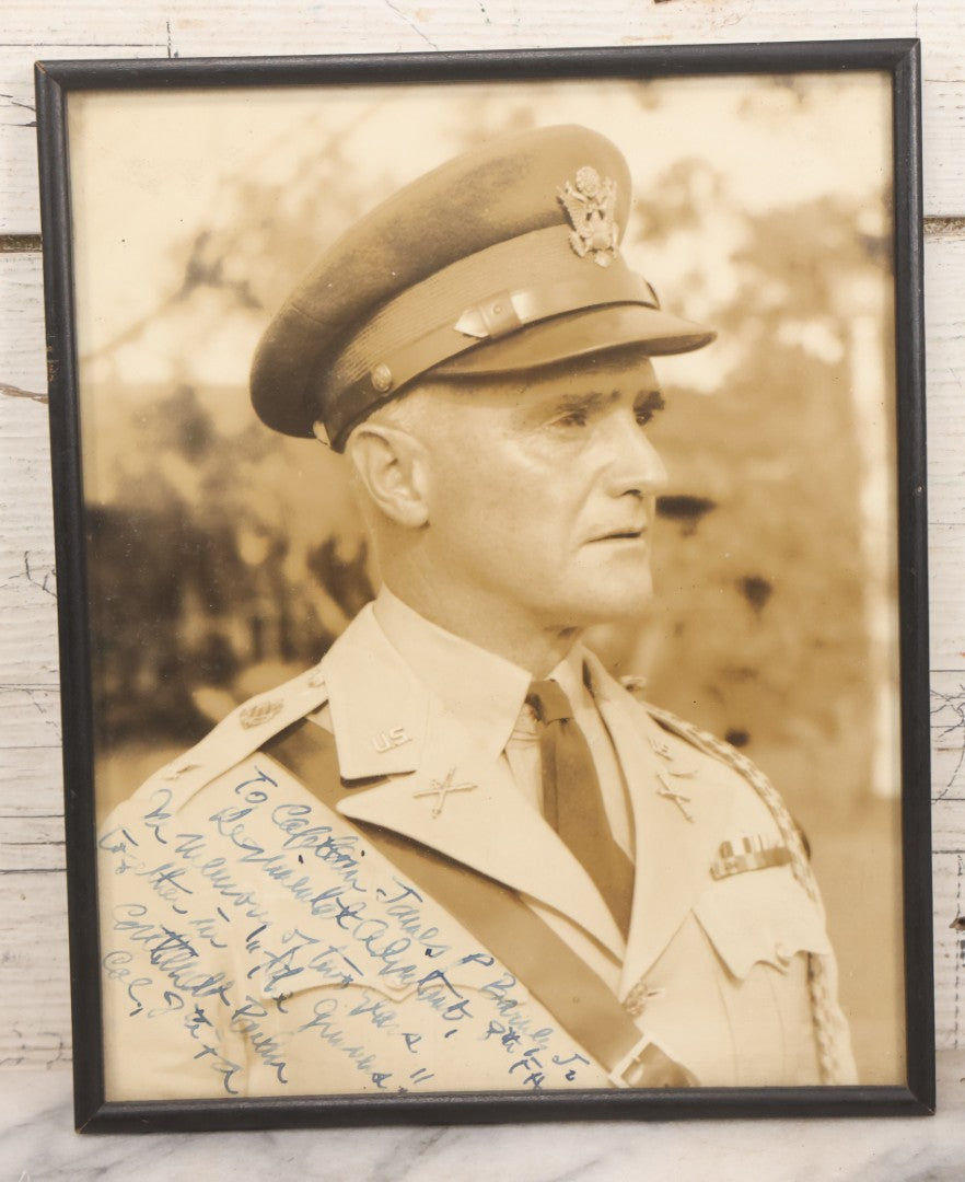 Lot 151 - Pair Of Vintage Military Portrait Photographs In Matching Black Wood Frames, Including Officer With Dog On Log Captioned "A Settin On A Log, Lovin On My Dog" And Portrait Inscribed To Captain James P. Baruly Jr.