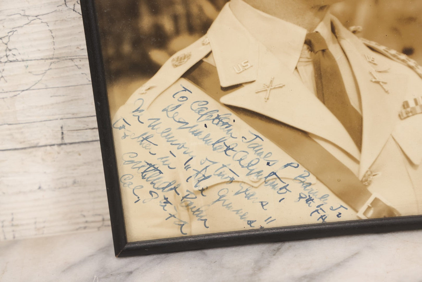 Lot 151 - Pair Of Vintage Military Portrait Photographs In Matching Black Wood Frames, Including Officer With Dog On Log Captioned "A Settin On A Log, Lovin On My Dog" And Portrait Inscribed To Captain James P. Baruly Jr.
