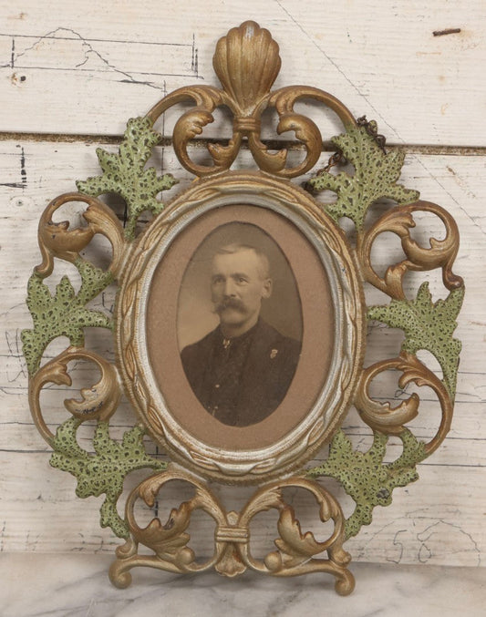 Lot 152 - Antique Decorative Cast Metal Frame With Silver, Gold, And Green Paint And Oval Portrait Of Man With Mustache