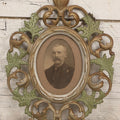 Lot 152 - Antique Decorative Cast Metal Frame With Silver, Gold, And Green Paint And Oval Portrait Of Man With Mustache