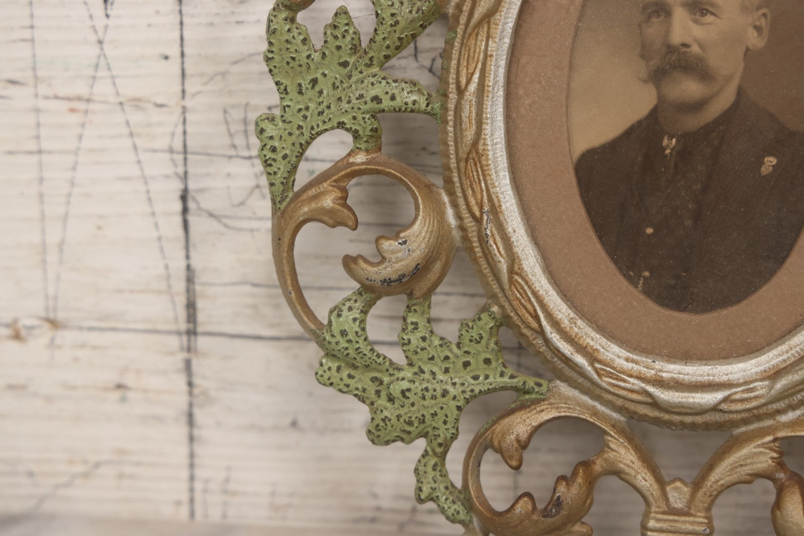 Lot 152 - Antique Decorative Cast Metal Frame With Silver, Gold, And Green Paint And Oval Portrait Of Man With Mustache