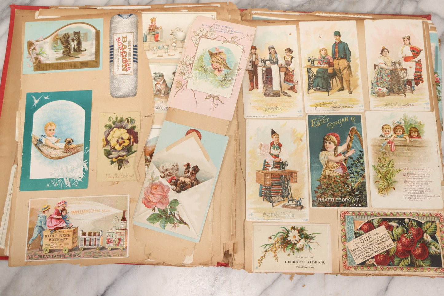 Lot 156 - Antique Victorian Trade Card And Die-Cut Scrapbook With Red Floral Cover, Containing 150+ Pieces, Pages Loose