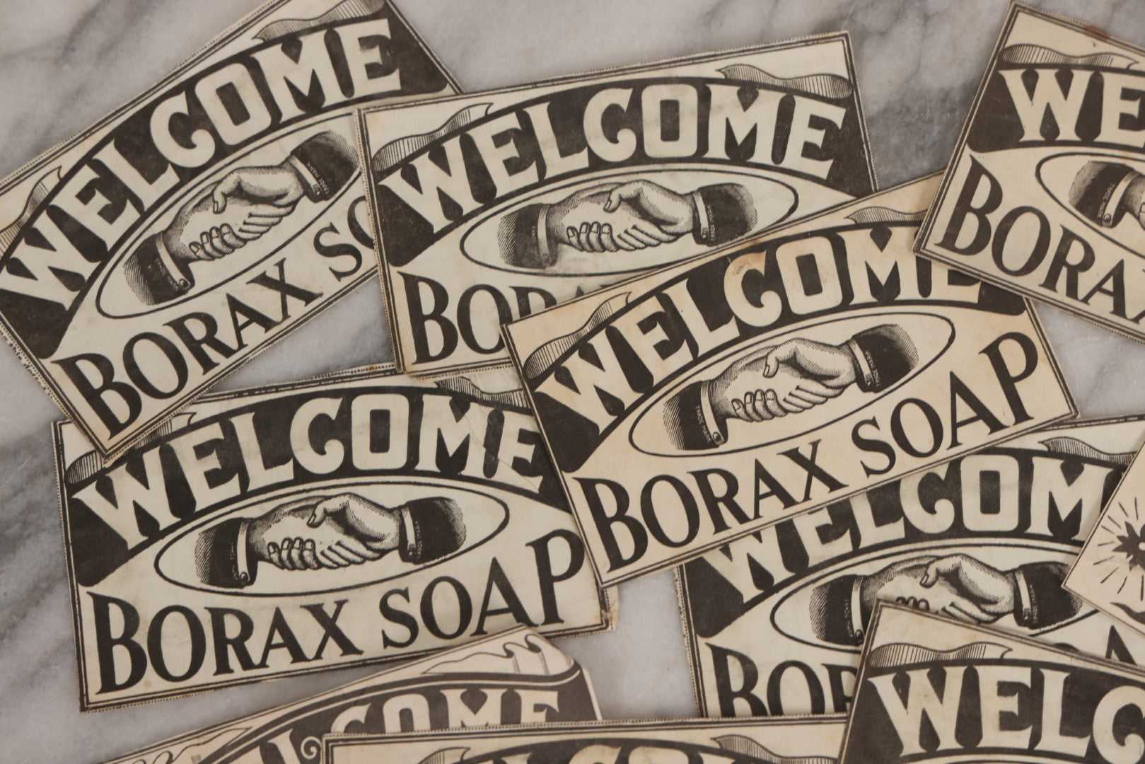 Lot 170 - Grouping Of 20+ Vintage Borax Soap “Welcome” Coupon Cut-Outs With Handshake Motif, Likely Premium/Redemption Slips On Thin Newsprint