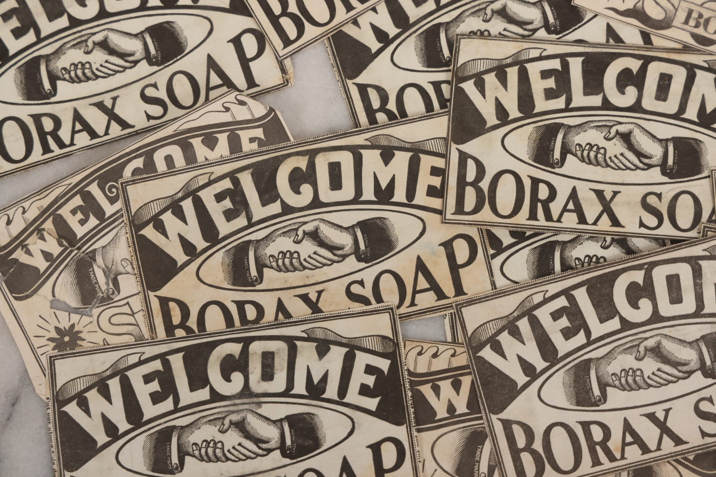 Lot 170 - Grouping Of 20+ Vintage Borax Soap “Welcome” Coupon Cut-Outs With Handshake Motif, Likely Premium/Redemption Slips On Thin Newsprint