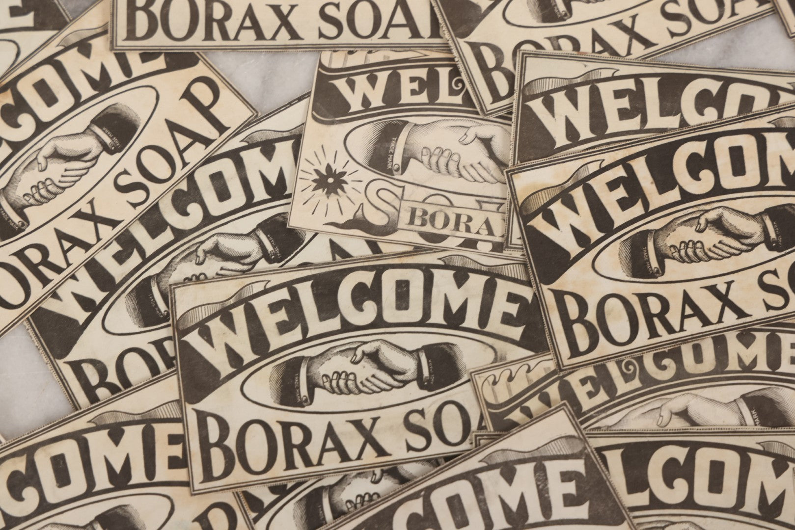 Lot 170 - Grouping Of 20+ Vintage Borax Soap “Welcome” Coupon Cut-Outs With Handshake Motif, Likely Premium/Redemption Slips On Thin Newsprint