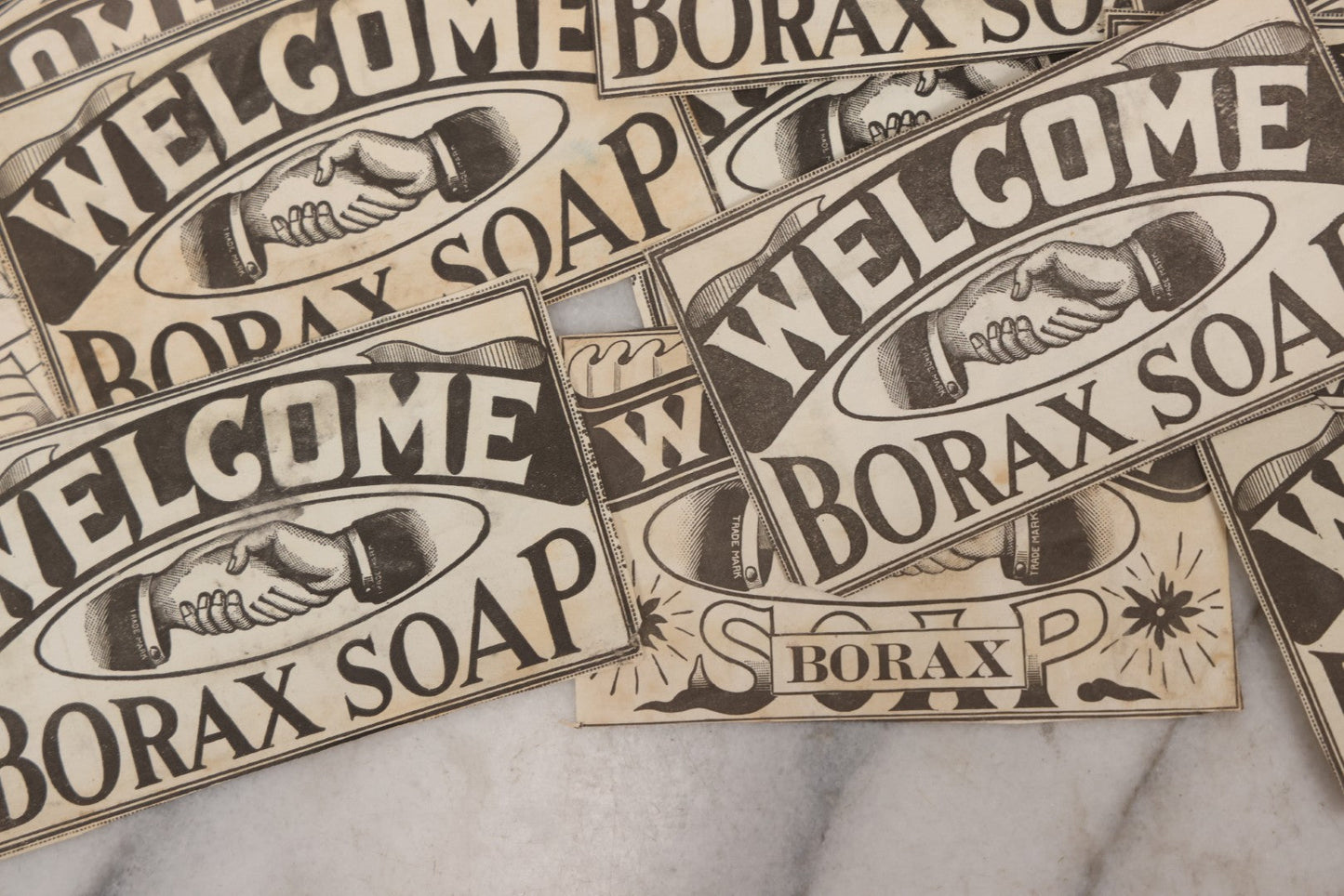 Lot 170 - Grouping Of 20+ Vintage Borax Soap “Welcome” Coupon Cut-Outs With Handshake Motif, Likely Premium/Redemption Slips On Thin Newsprint