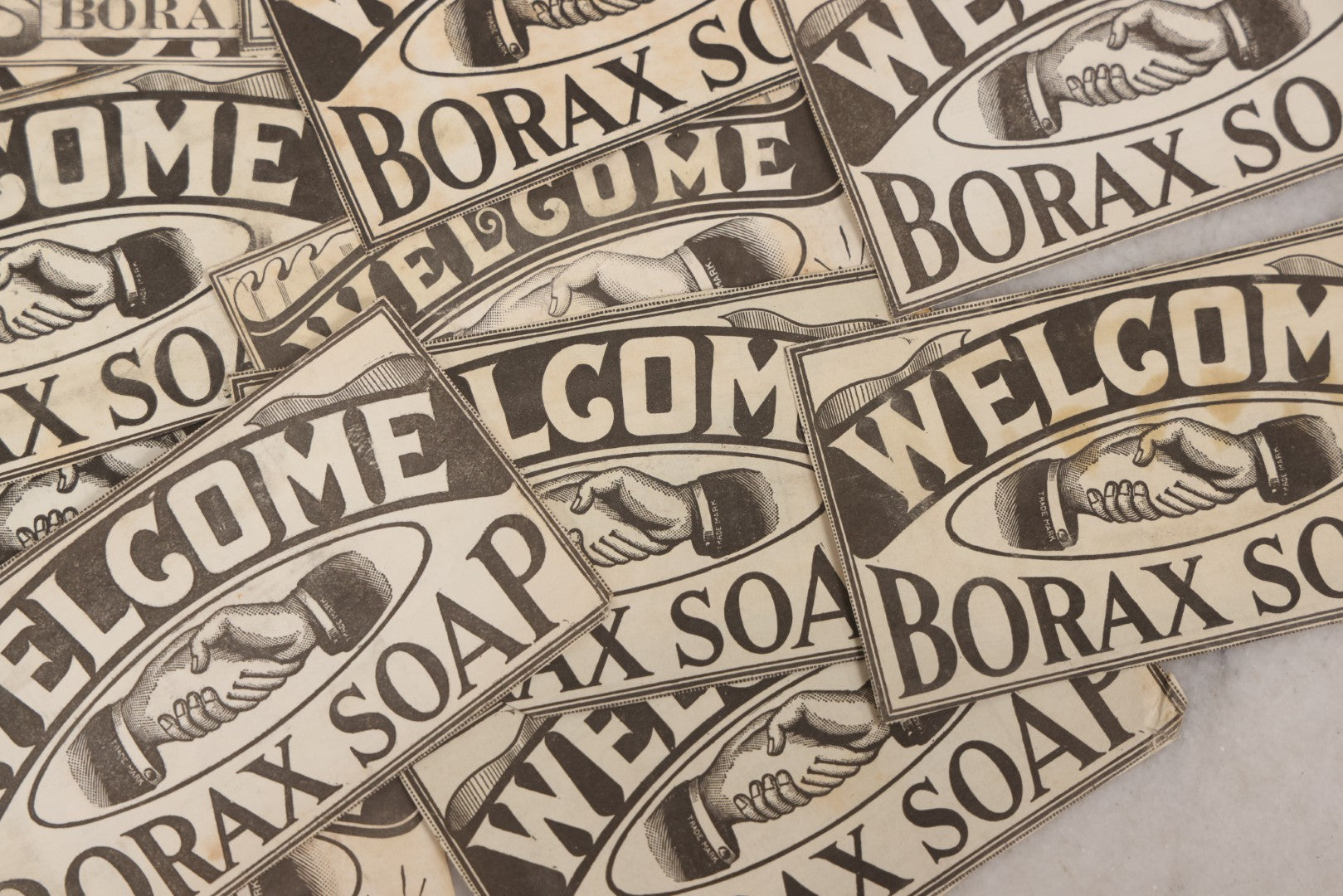 Lot 170 - Grouping Of 20+ Vintage Borax Soap “Welcome” Coupon Cut-Outs With Handshake Motif, Likely Premium/Redemption Slips On Thin Newsprint