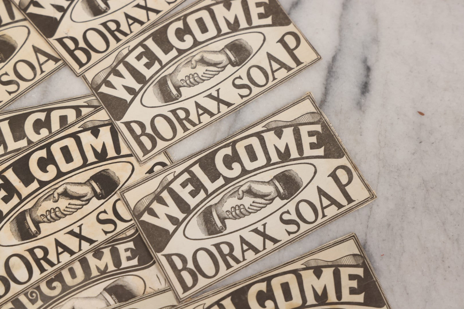 Lot 170 - Grouping Of 20+ Vintage Borax Soap “Welcome” Coupon Cut-Outs With Handshake Motif, Likely Premium/Redemption Slips On Thin Newsprint