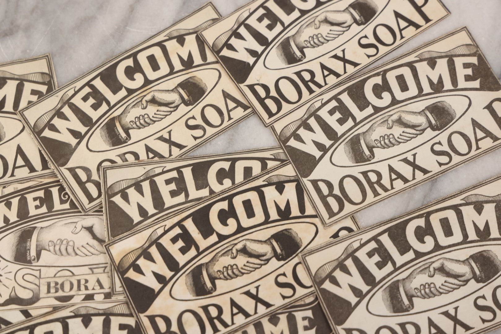 Lot 170 - Grouping Of 20+ Vintage Borax Soap “Welcome” Coupon Cut-Outs With Handshake Motif, Likely Premium/Redemption Slips On Thin Newsprint