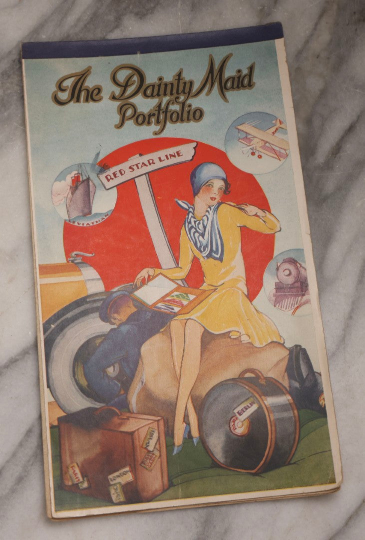 Lot 198 - Antique “The Dainty Maid Portfolio” Sketchbook With Illustrated Cover Of Traveling Woman And Serviceman, Blank Interior Pages