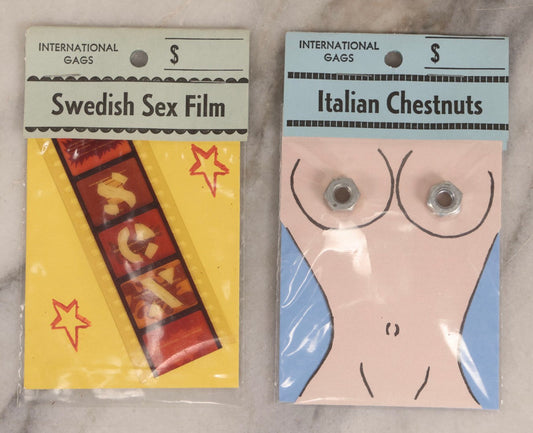 Lot 201 - Pair Of Vintage “International Gags” Offensive Stereotype Novelty Jokes, "Italian Chestnuts" And "Swedish Sex Film," By Wade Enterprises, East Granby, Connecticut
