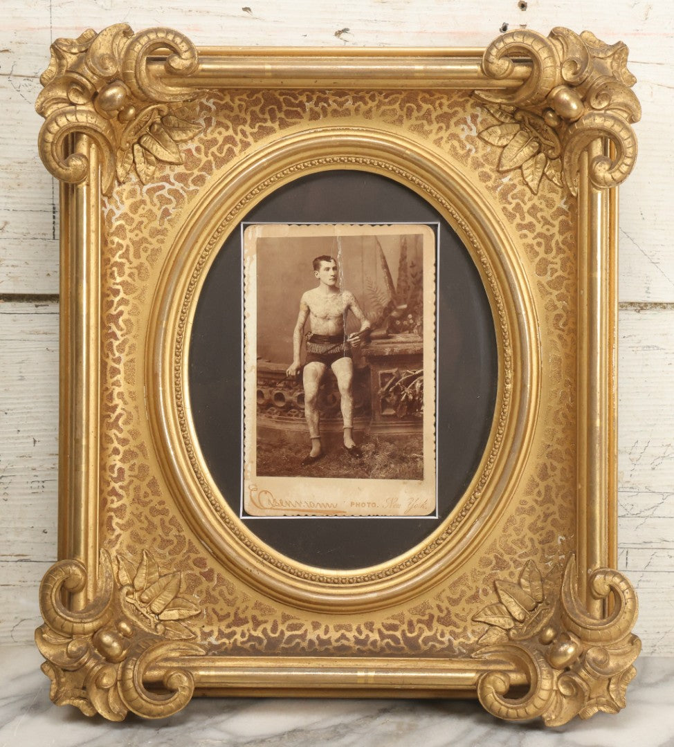 Lot 001 - Antique Cabinet Card Photograph Of Thomas Sidonia “The Tattooed Boy” At Age 21, Photographed By Charles Eisenmann, New York, Custom Framed With Visible Verso Inscription And Clear View Of Early American Traditional Tattoos, 13" x 15"