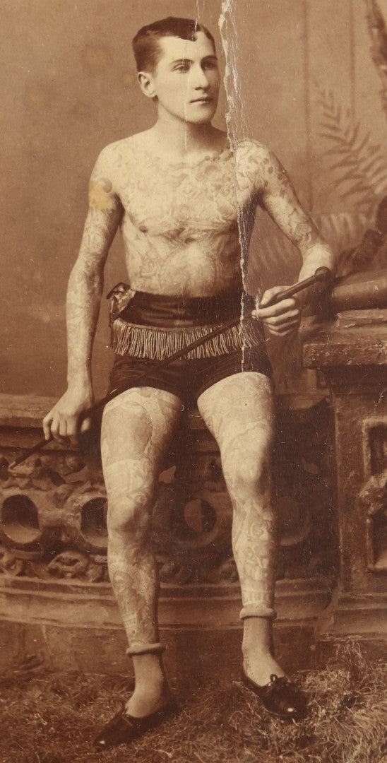 Lot 001 - Antique Cabinet Card Photograph Of Thomas Sidonia “The Tattooed Boy” At Age 21, Photographed By Charles Eisenmann, New York, Custom Framed With Visible Verso Inscription And Clear View Of Early American Traditional Tattoos, 13" x 15"