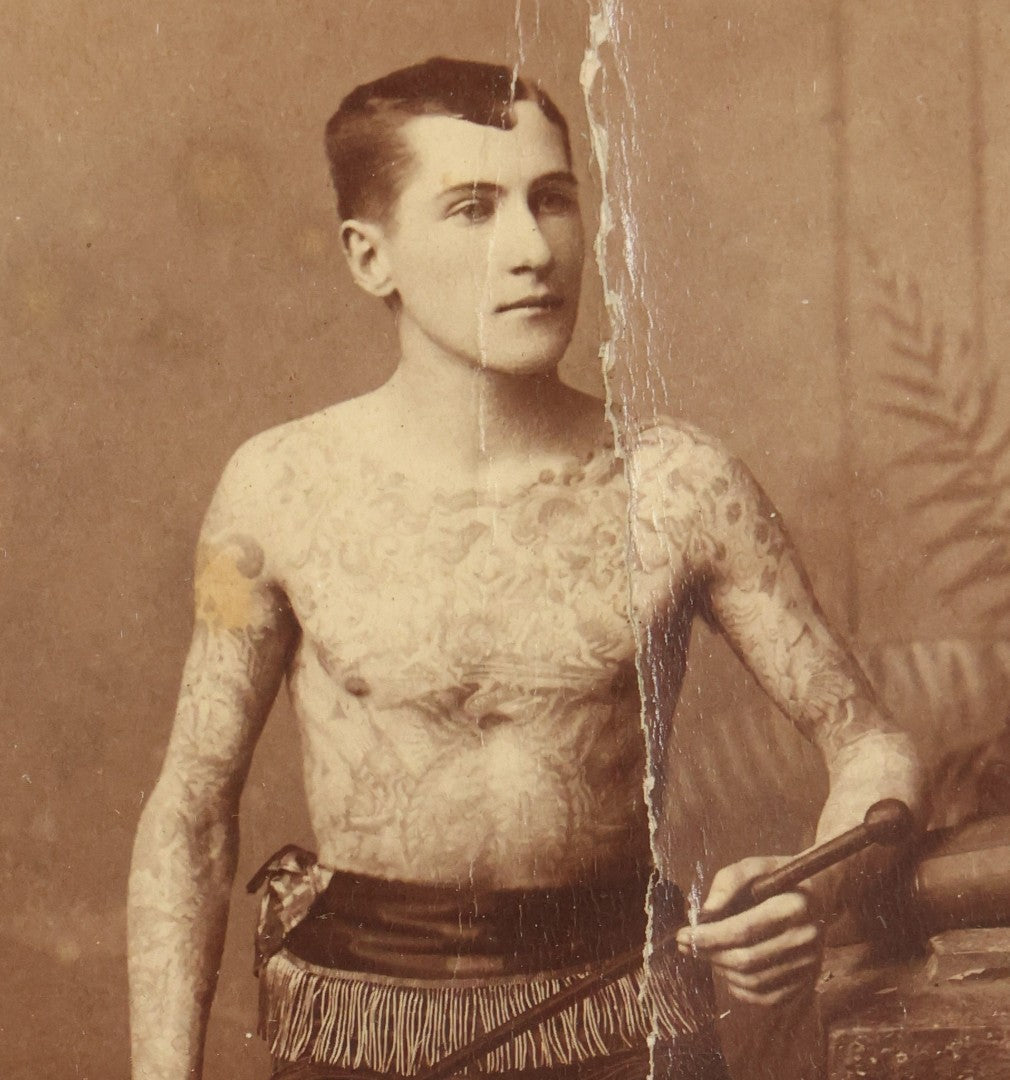 Lot 001 - Antique Cabinet Card Photograph Of Thomas Sidonia “The Tattooed Boy” At Age 21, Photographed By Charles Eisenmann, New York, Custom Framed With Visible Verso Inscription And Clear View Of Early American Traditional Tattoos, 13" x 15"