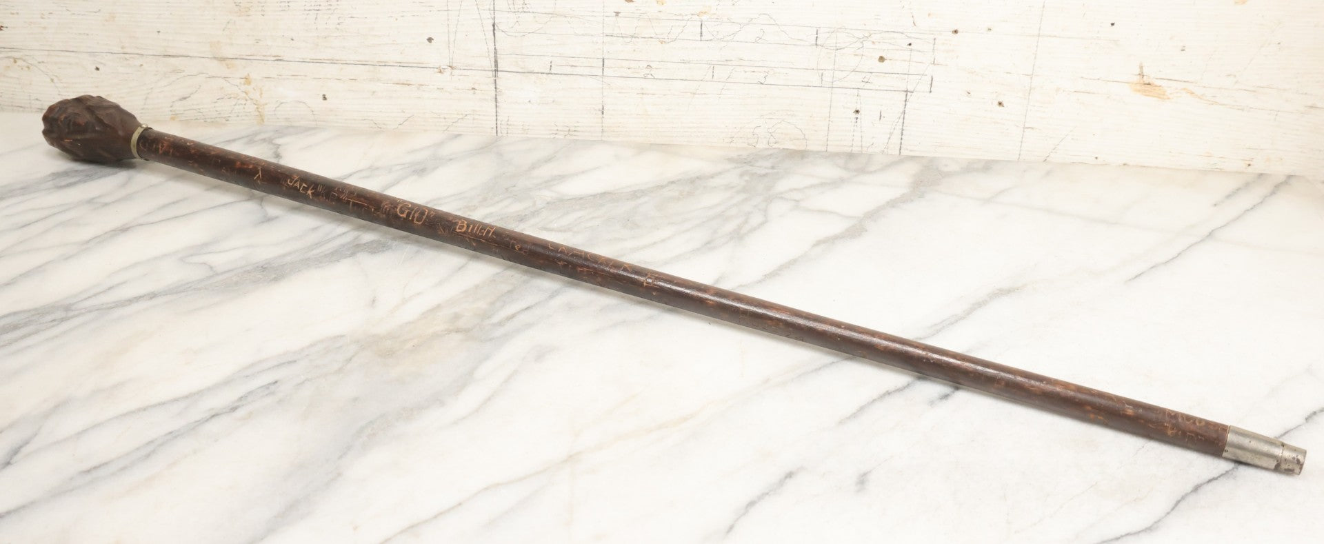 Lot 003 - Vintage Hand-Carved White Mountains, New Hampshire Folk Art Hiking Stick With Double-Sided Old Man Of The Mountain Carved Handle And Decades Of Carved Initials, Names, And Nicknames, 36" L
