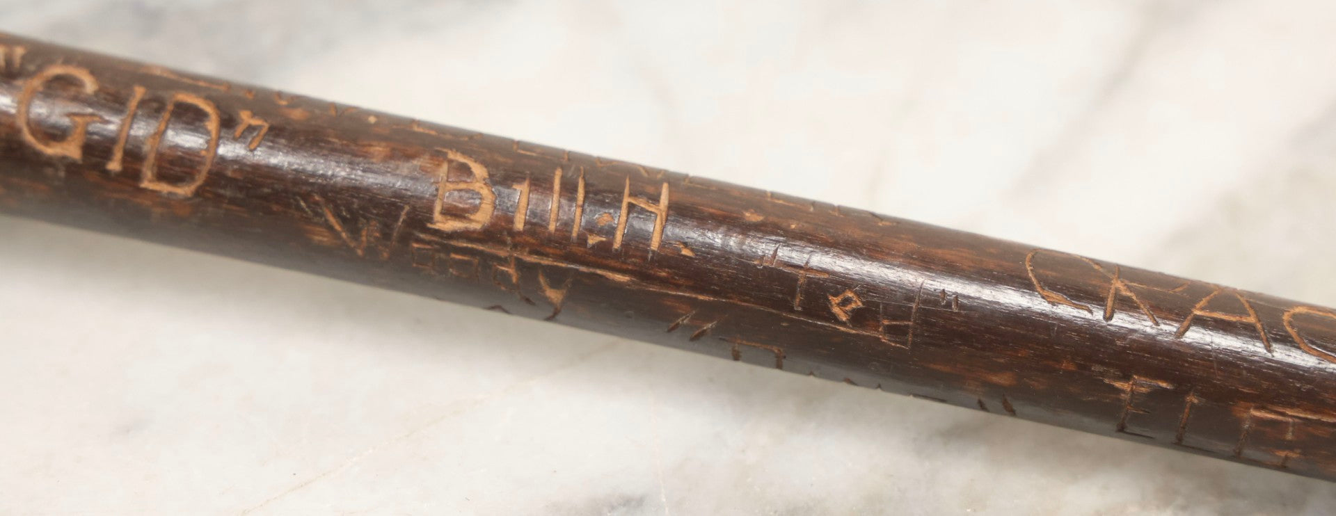 Lot 003 - Vintage Hand-Carved White Mountains, New Hampshire Folk Art Hiking Stick With Double-Sided Old Man Of The Mountain Carved Handle And Decades Of Carved Initials, Names, And Nicknames, 36" L