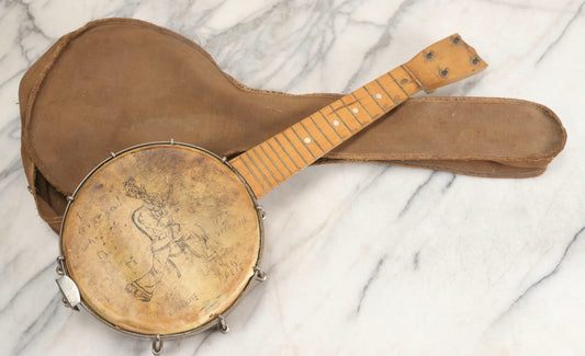 Lot 006 - Vintage Gretsch Clarophone Banjo Ukulele Banjolele With Folk Art Drawing On Head Of Cartoon Man Playing Instrument, Includes Canvas Carrying Bag, Circa 1930s