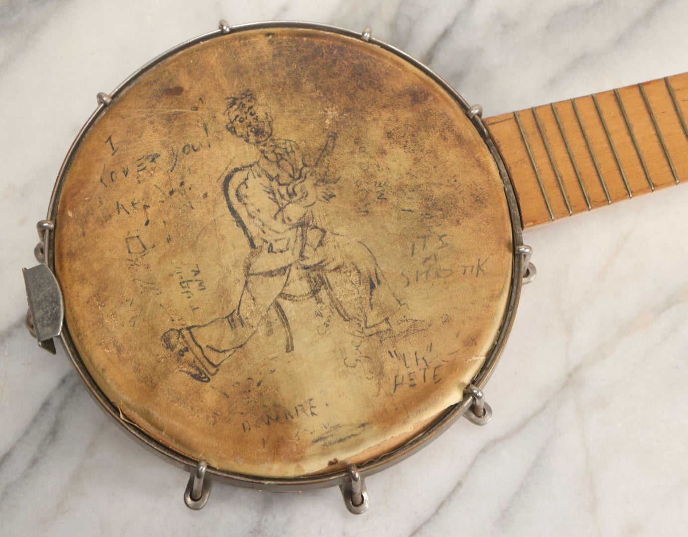 Lot 006 - Vintage Gretsch Clarophone Banjo Ukulele Banjolele With Folk Art Drawing On Head Of Cartoon Man Playing Instrument, Includes Canvas Carrying Bag, Circa 1930s