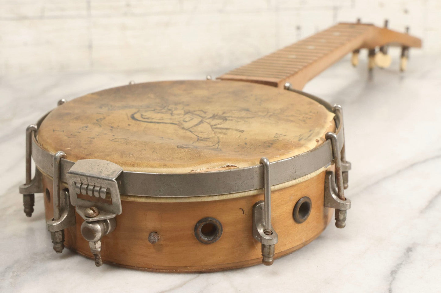 Lot 006 - Vintage Gretsch Clarophone Banjo Ukulele Banjolele With Folk Art Drawing On Head Of Cartoon Man Playing Instrument, Includes Canvas Carrying Bag, Circa 1930s