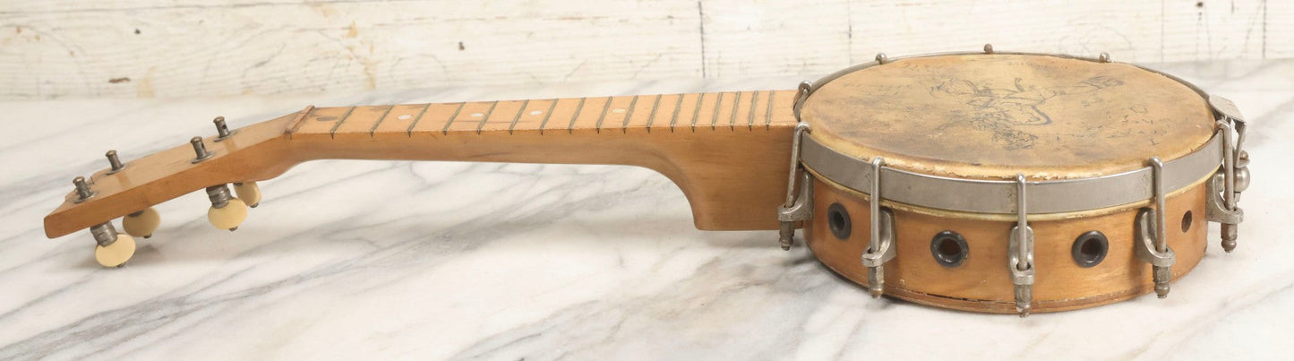 Lot 006 - Vintage Gretsch Clarophone Banjo Ukulele Banjolele With Folk Art Drawing On Head Of Cartoon Man Playing Instrument, Includes Canvas Carrying Bag, Circa 1930s