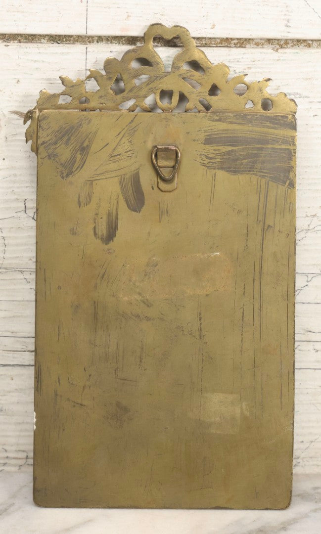 Lot 012 - Antique Painted Porcelain Tile Of Young Praying Woman In Brass Frame With Crest, Note Large Diagonal Crack Through Tile And Multiple Cracks From Upper Left Corner Damage, 4-7/8" x 9-1/8"