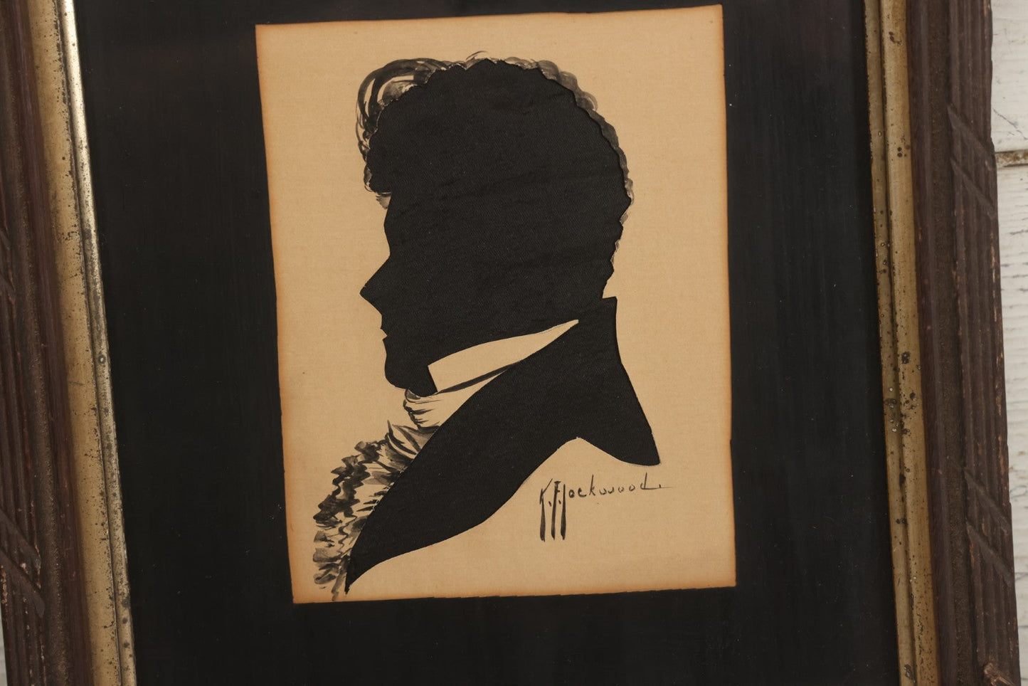 Lot 014 - Antique Hand-Cut And Hand-Painted Black Silk And Paper Silhouette Of Man In Profile With Cravat, Signed K.F. Lockwood, In Antique Wood Frame With Corner Ornaments, Circa 1850