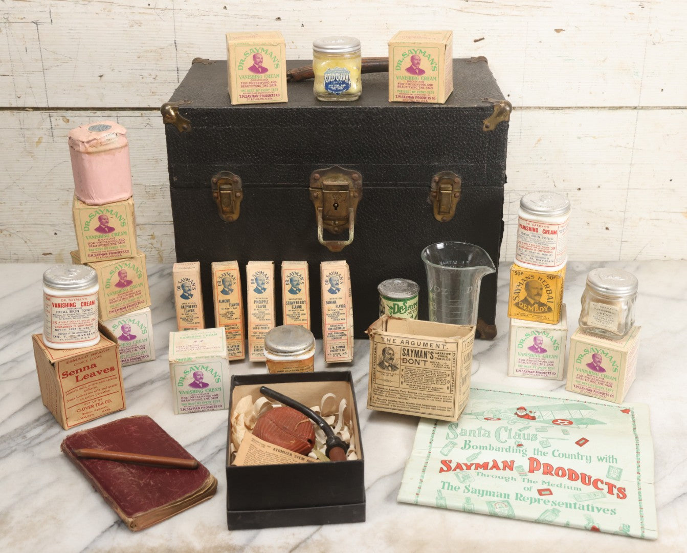 Lot 016 - Antique Traveling Salesman's Patent Medicine Case With Extensive Contents From T.M. Sayman Products Co., St. Louis, Missouri — Nos Vanishing Creams, Flavoring Extracts, Remedies, Ephemera & Sales Ledger
