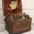 Lot 017 - Antique 19th Century Traveling Apothecary Kit In Leather-Wrapped Wood Box Stamped “Hoff's Patent, March 27, 1883,” With 20+ Glass Medicine Bottles And Internal Till, 9" H