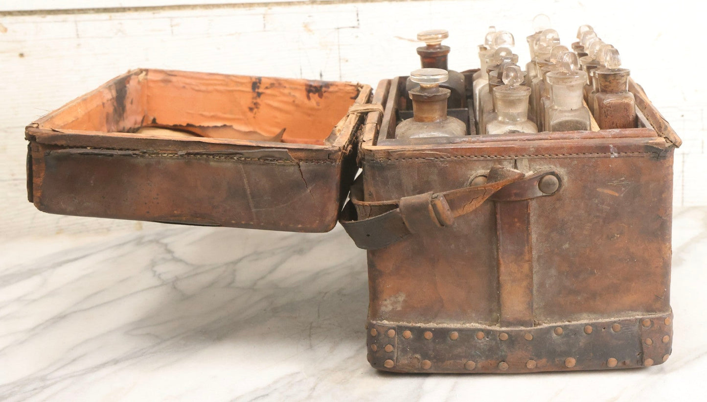 Lot 017 - Antique 19th Century Traveling Apothecary Kit In Leather-Wrapped Wood Box Stamped “Hoff's Patent, March 27, 1883,” With 20+ Glass Medicine Bottles And Internal Till