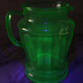 Lot 021 - Antique Uranium Glass Pitcher With Paneled Form, Glows Under Blacklight, Note Chip On Spout And Stress Crack On Handle, 8" H