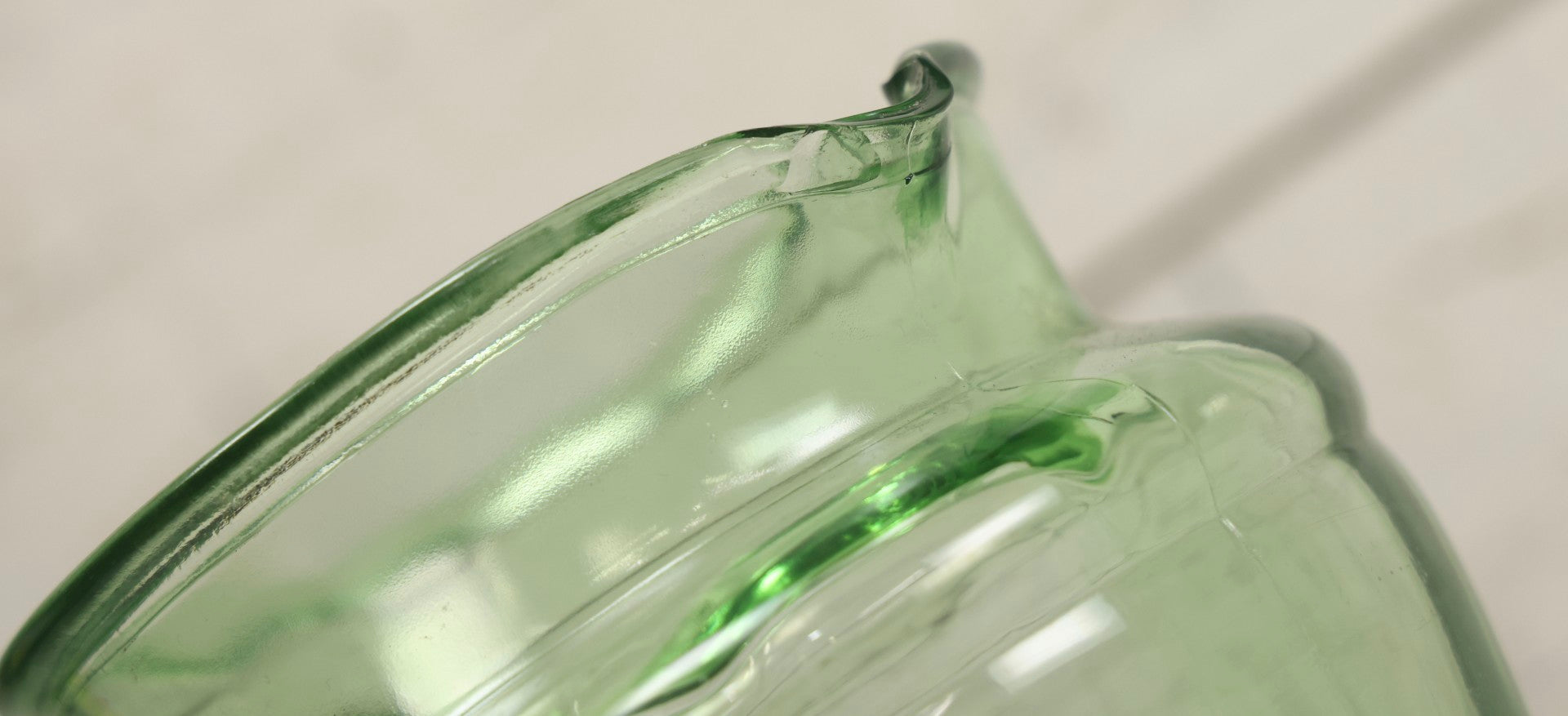 Lot 021 - Antique Uranium Glass Pitcher With Paneled Form, Glows Under Blacklight, Note Chip On Spout And Stress Crack On Handle