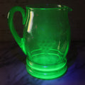 Lot 022 - Antique Uranium Glass Pitcher With Etched Grape Motif, Glows Under Blacklight, Note Chip On Spout, 8" H