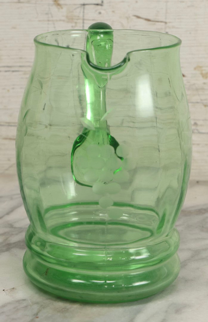 Lot 022 - Antique Uranium Glass Pitcher With Etched Grape Motif, Glows Under Blacklight, Note Chip On Spout