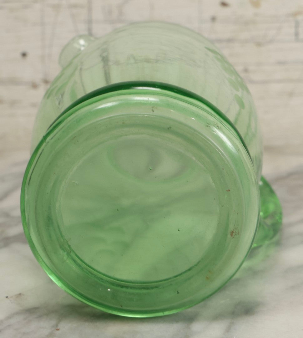 Lot 022 - Antique Uranium Glass Pitcher With Etched Grape Motif, Glows Under Blacklight, Note Chip On Spout